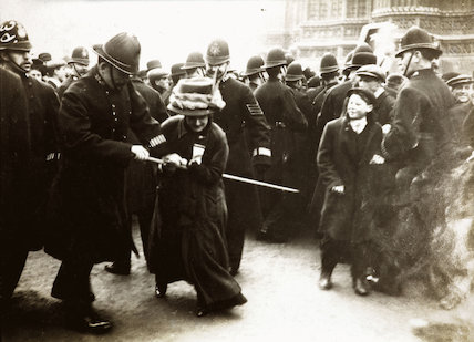 A woman struggles with the police on Black Friday, 18 November 1910.